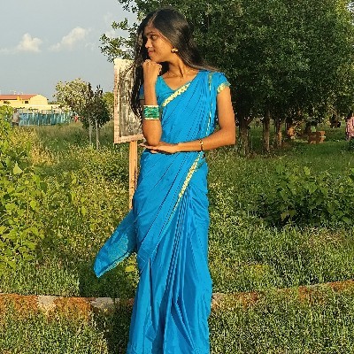 Veena B